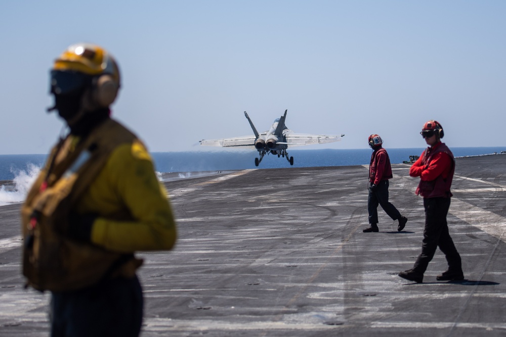 The &quot;Fighting Swordsmen&quot; of Strike Fighter Squadron (VFA) 32 Conduct an Airborne Change of Command Ceremony in the Red Sea