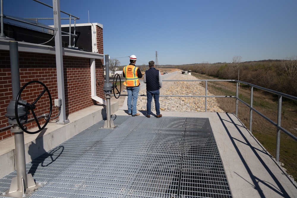 Scott Mensing, Kansas City Levees program manager, speaks with Eric Adler, a reporter for the Kansas City Star, at the Armourdale Pump Station in Kansas City, Kan. on Apr. 4, 2024.