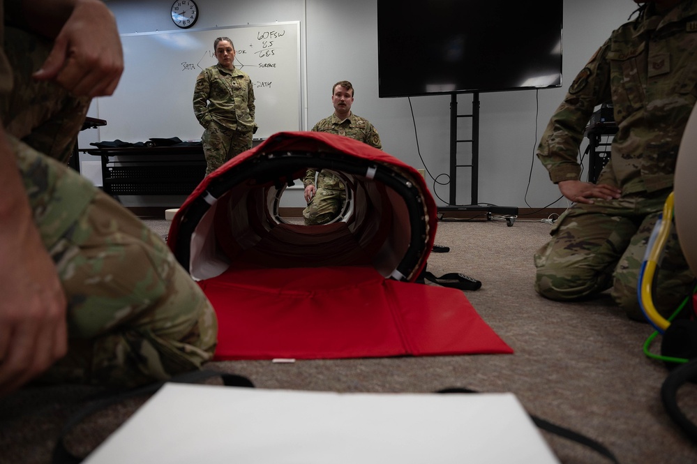 354th MDG holds hyperlite chamber training