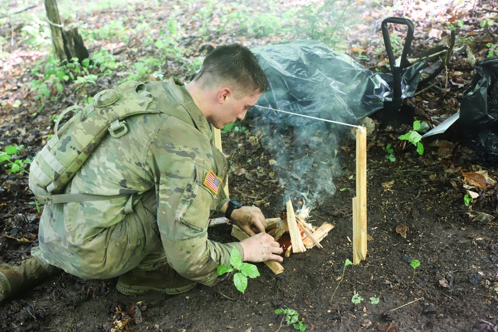 Pennsylvania Army National Guard Soldier builds a fire during 2024 Region II Best Warrior Competition