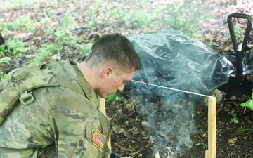 Pennsylvania Army National Guard Soldier builds a fire during 2024 Region II Best Warrior Competition