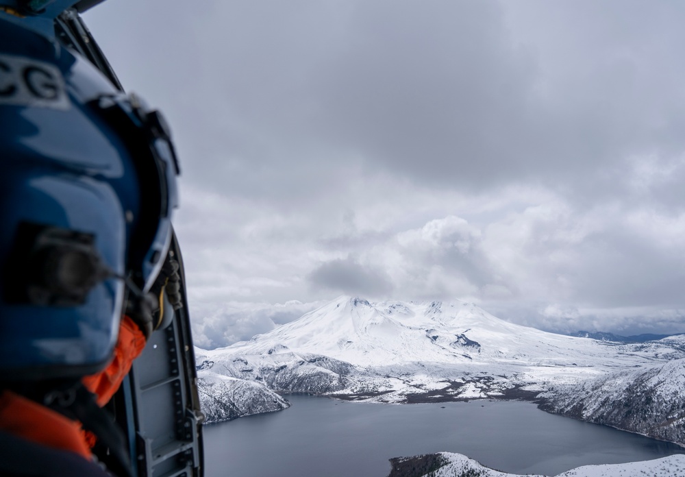 Coast Guard MH-60 Jayhawk helicopter aircrews from Air Station Astoria train above Mount St. Helens