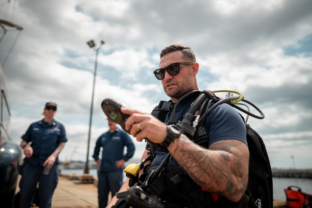 Divers inspect Coast Guard Cutter Eagle