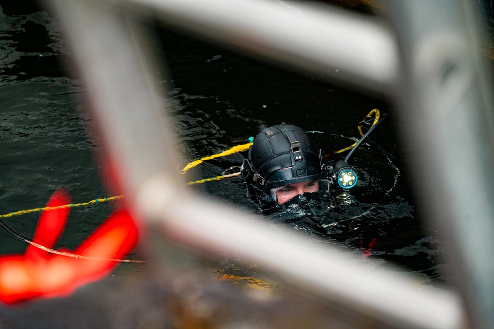 Divers inspect Coast Guard Cutter Eagle