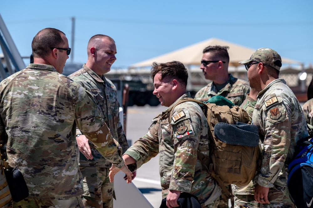 Airmen from the 99th Security Forces Squadron return home