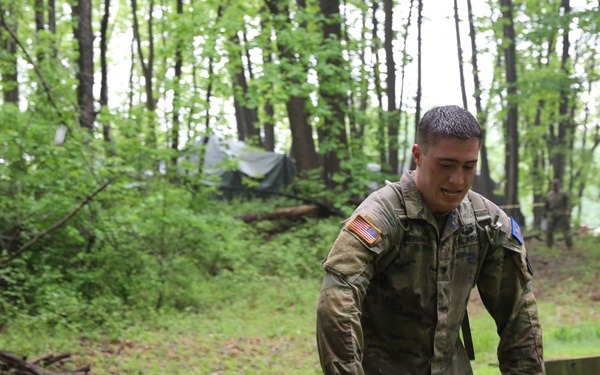 Pennsylvania Army National Guard Soldier Carries Ammo Boxes for Region Two Best Warrior Competition