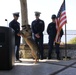 The U.S. Coast Guard Maritime Safety and Security Team Kings Bay (91108) crew celebrate Chief Canine Jenny's retirement