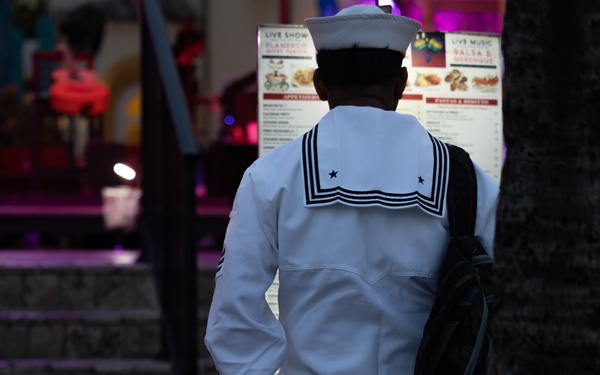 U.S. Navy Sailor reads a menu during Fleet Week Miami 2024