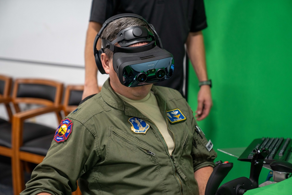 Lt. Col. Pat McKelvey, a Nevada Air National Guard pilot, practices aerial wildland firefighting drops in the simulator