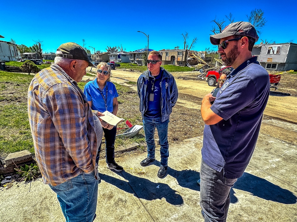 FEMA Officials Talks with a Disaster Survivor