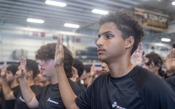 Future U.S. Marines and Sailors take the oath of enlistment aboard the USS Bataan