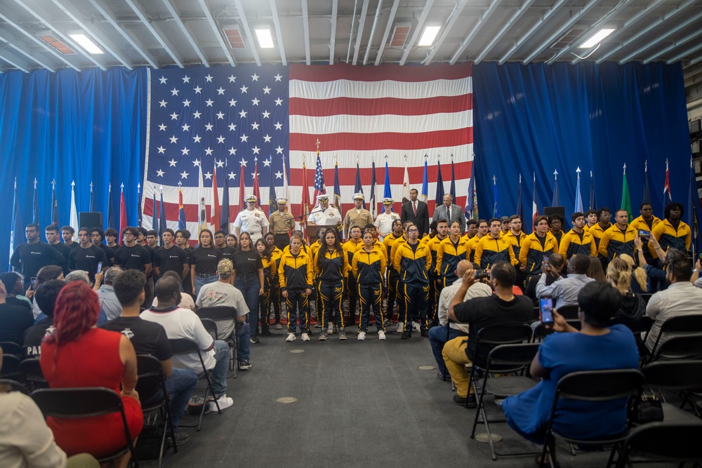 Future U.S. Marines and Sailors take the oath of enlistment aboard the USS Bataan