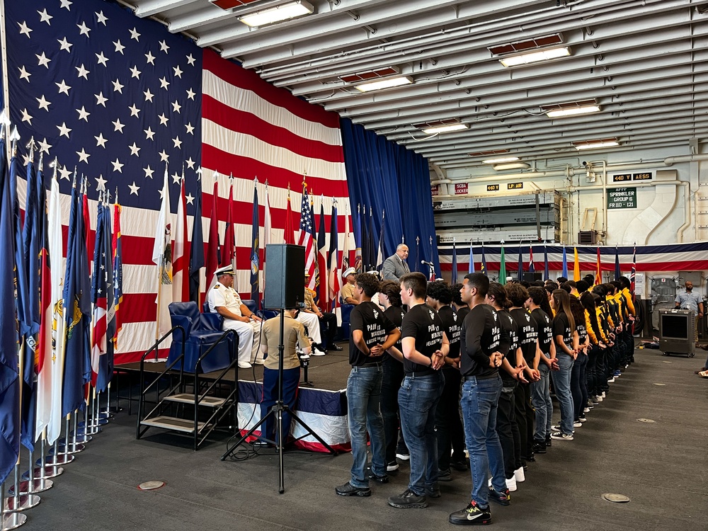 Future U.S. Sailors and Marines stand at parade rest as the Secretary of the Navy Carlos Del Toro speaks during Fleet Week Miami 2024