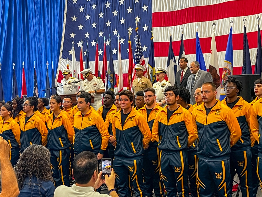 Future U.S. Marines and Sailors stand at parade rest after an Oath of Enlistment ceremony during Fleet Week Miami 2024