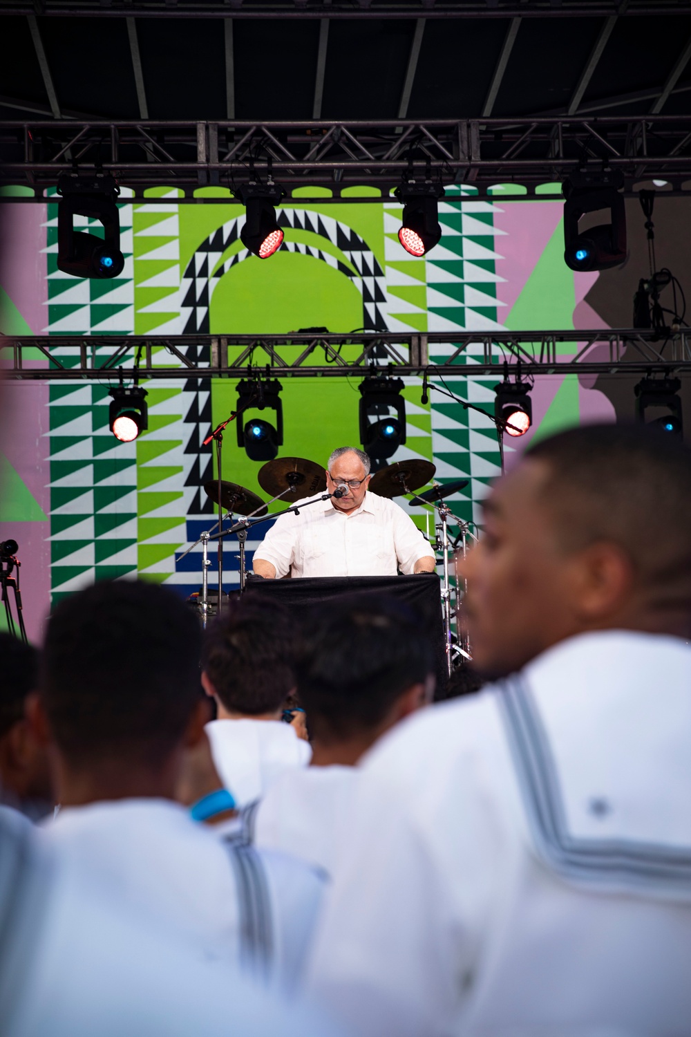Secretary of the Navy Carlos Del Toro addresses U.S. Maritime Service Members during an All Hands Welcome Concert