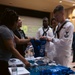 U.S. Navy Sailors interact with the staff at the Miami VA Medical Center during Fleet Week Miami 2024