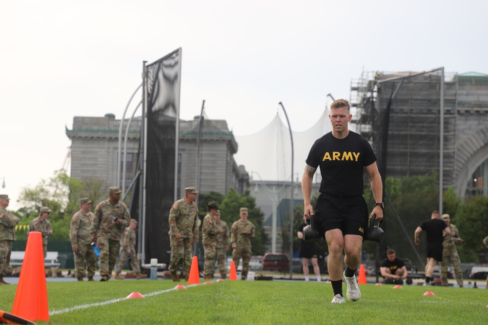 Maryland Army National Guard Soldier Carries Kettlebells during the ACFT