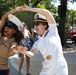 Cpl. Elizabeth Bido, from the Bronx, NY, assigned to the 2nd Combat Readiness Regiment and Lt Lillian Mcbee, from Miami, assigned to the Littoral Combat Ship Squadron (LCSRON) 2, dance in Domino Park in Miami during Miami Fleet Week, May 8, 2024.