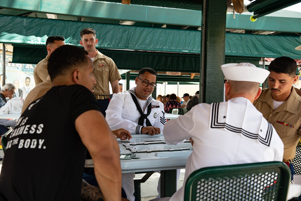 Sailors and Marines play domino’s at Domino Park in Miami during Miami Fleet Week, May 8, 2024.