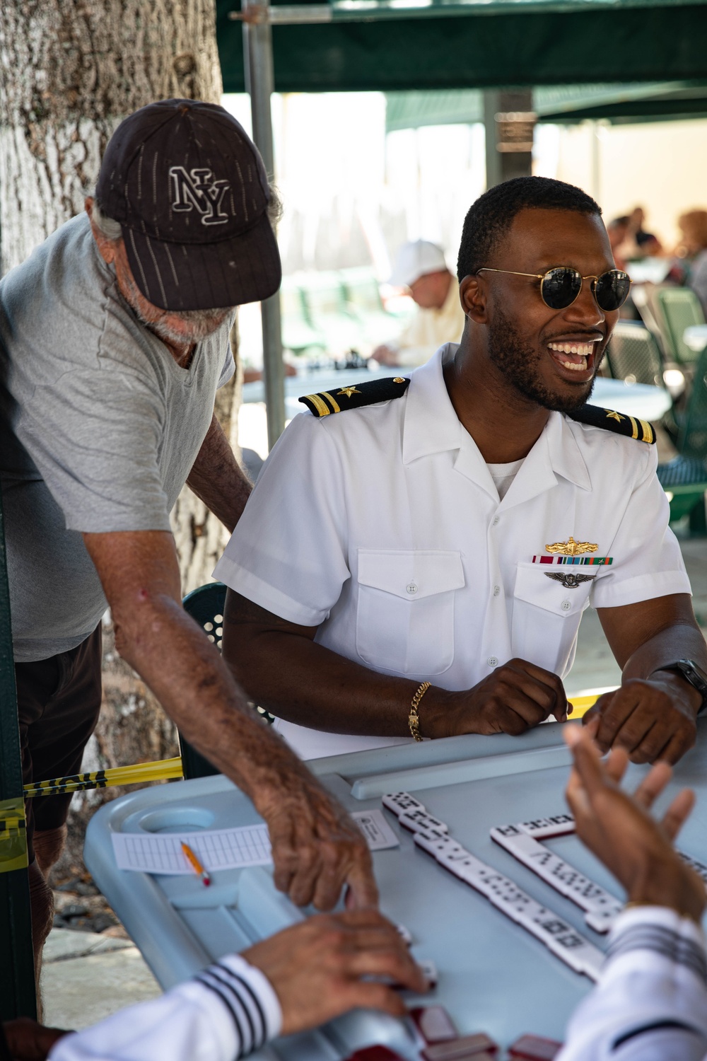 U.S. Navy Lt.j.g Lavaujhn Holloman, assigned to the guided-missile cruiser USS Normandy (CG 60), plays domino’s at Domino Park in Miami during Miami Fleet Week, May 8, 2024.