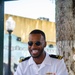 U.S. Navy Lt. j. g. Lavaujhn Holloman, from Norfolk, Va., assigned to the guided-missile cruiser USS Normandy (CG 60), plays dominoes in Domino Park, Miami, during Fleet Week Miami, May 8, 2024.