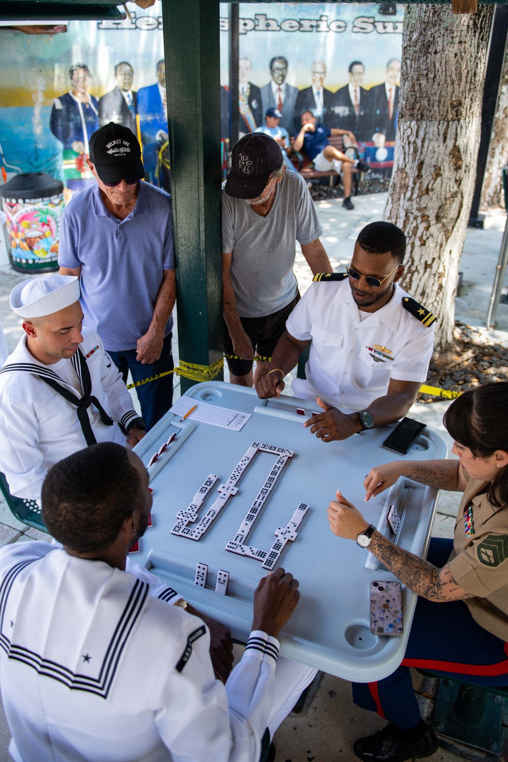 U.S. Navy Sailors and Marines play dominoes in Domino Park, Miami, during Fleet Week Miami, May 8, 2024.