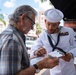 U.S. Navy Hospital Corpsman 3rd Class James Reddic, from St. Louis, assigned to the amphibious assault ship USS Bataan (LHD 5), looks at a portrait in Miami during Fleet Week Miami, May 8, 2024.