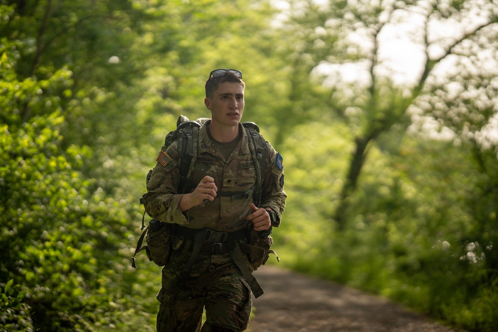 Pennsylvania Army National Guard Specialist rucks during Region 2 Best Warrior Competition