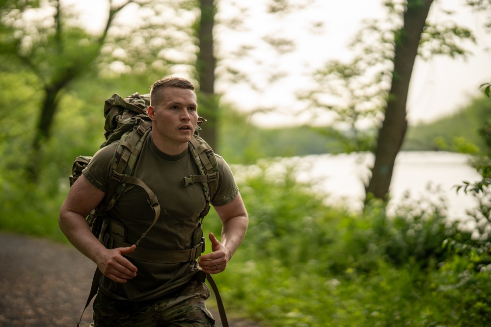 West Virginia Army National Guard Specialist rucks during Region 2 Best Warrior Competition