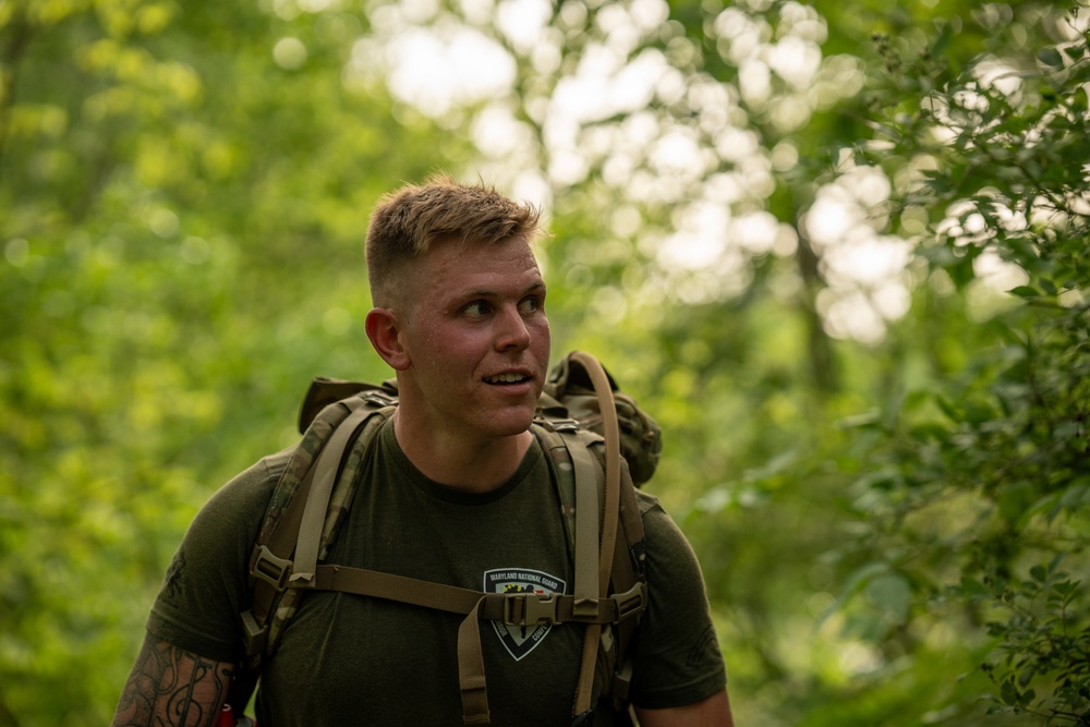 Maryland Army National Guard Intel Analyst rucks during Region 2 Best Warrior Competition