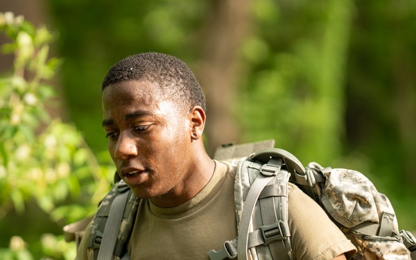 Delaware Army National Guard Soldier rucks during Region 2 Best Warrior Competition