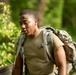 Delaware Army National Guard Soldier rucks during Region 2 Best Warrior Competition