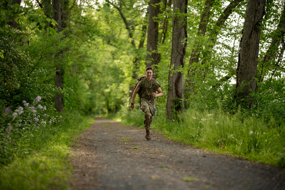 Spc. Cooper rucks during Region 2 Best Warrior Competition