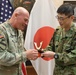 Japanese officer presents gift to FCOE CG