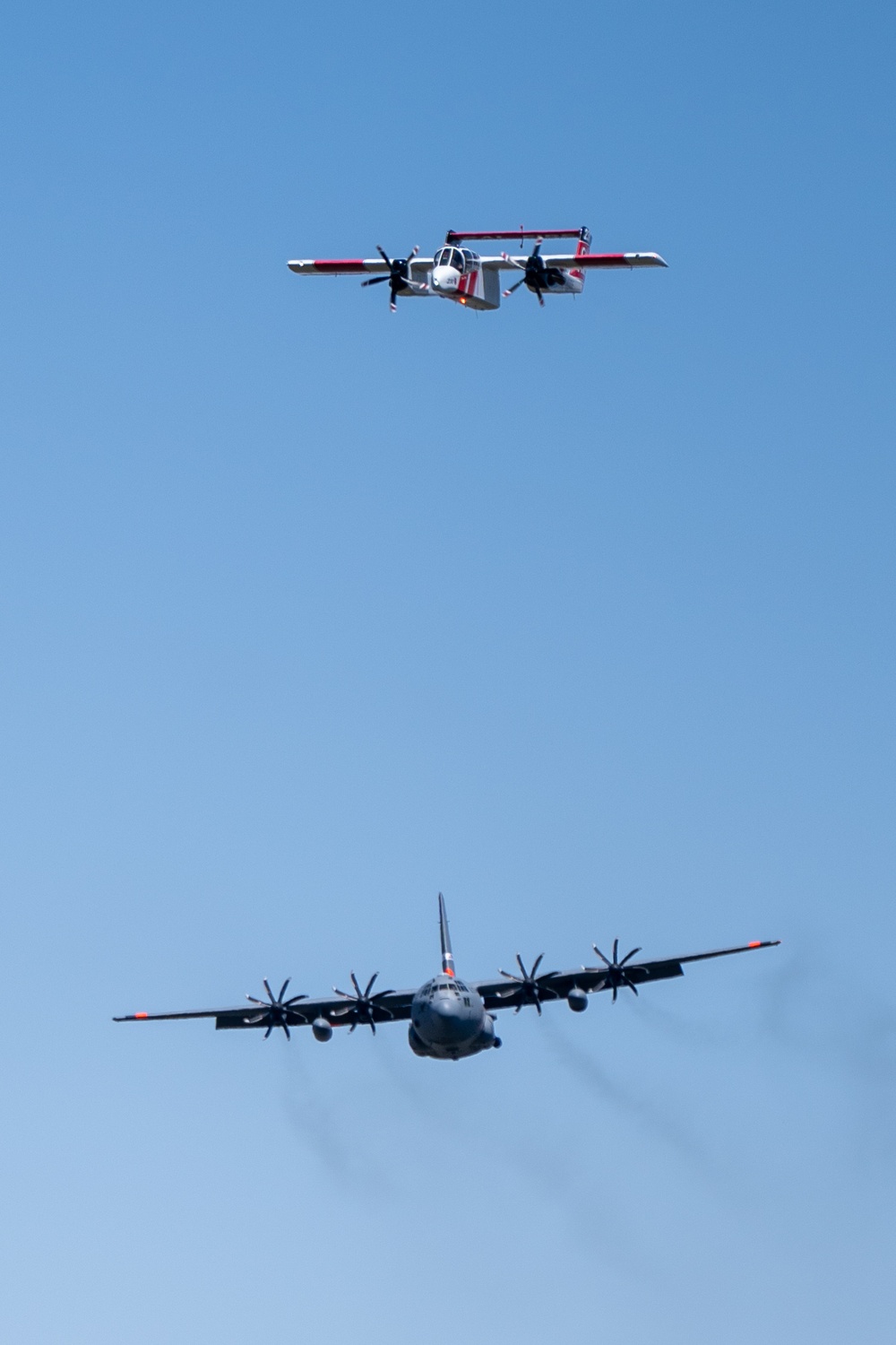 A C-130 (MAFFS 9) from Nevada Air National Guard's 152nd Airlift Wing and a U.S. Forest Service Lead Aircraft line up for a practice water drop May 8, 2024, during Modular Airborne Fire Fighting System (MAFFS) Spring Training 2024