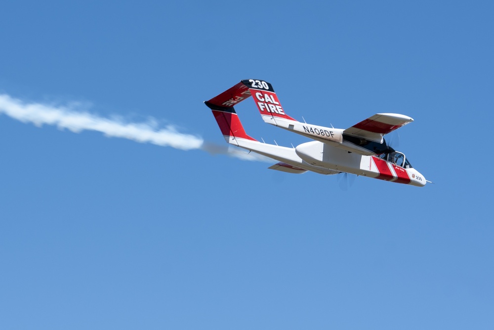 U.S. Forest Service Lead Aircraft dispenses a puff of smoke during Modular Airborne Fire Fighting System (MAFFS) Spring Training 2024 on May 8, 2024