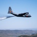 A C-130 (MAFFS 9) from Nevada Air National Guard's 152nd Airlift Wing performs a water drop May 8, 2024, during Modular Airborne Fire Fighting System (MAFFS) Spring Training