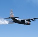 A C-130 (MAFFS 9) from Nevada Air National Guard's 152nd Airlift Wing performs a water drop May 8, 2024, during Modular Airborne Fire Fighting System (MAFFS) Spring Training 2024