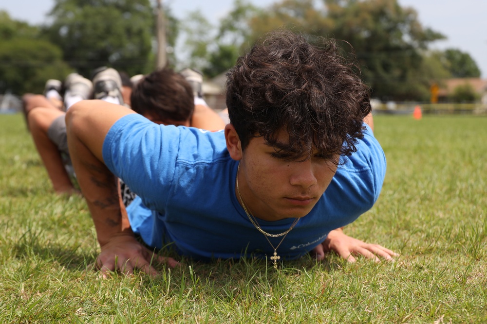 U.S. Marines Conduct The Glazier Clinics CFT Event With Erath High School Football Players