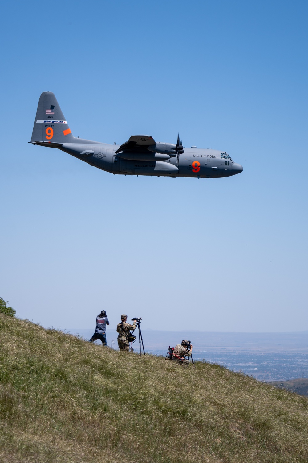 Public Affairs Airmen capture a C-130 (MAFFS 9) from Nevada Air National Guard's 152nd Airlift Wing doing a dry pass