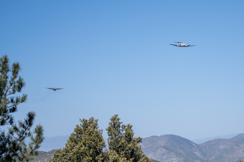 U.S. Forest Service Lead Plane leads a C-130 from Wyoming Air National Guard's 153rd Airlift Wing during Modular Airborne Fire Fighting System (MAFFS) Spring Training 2024