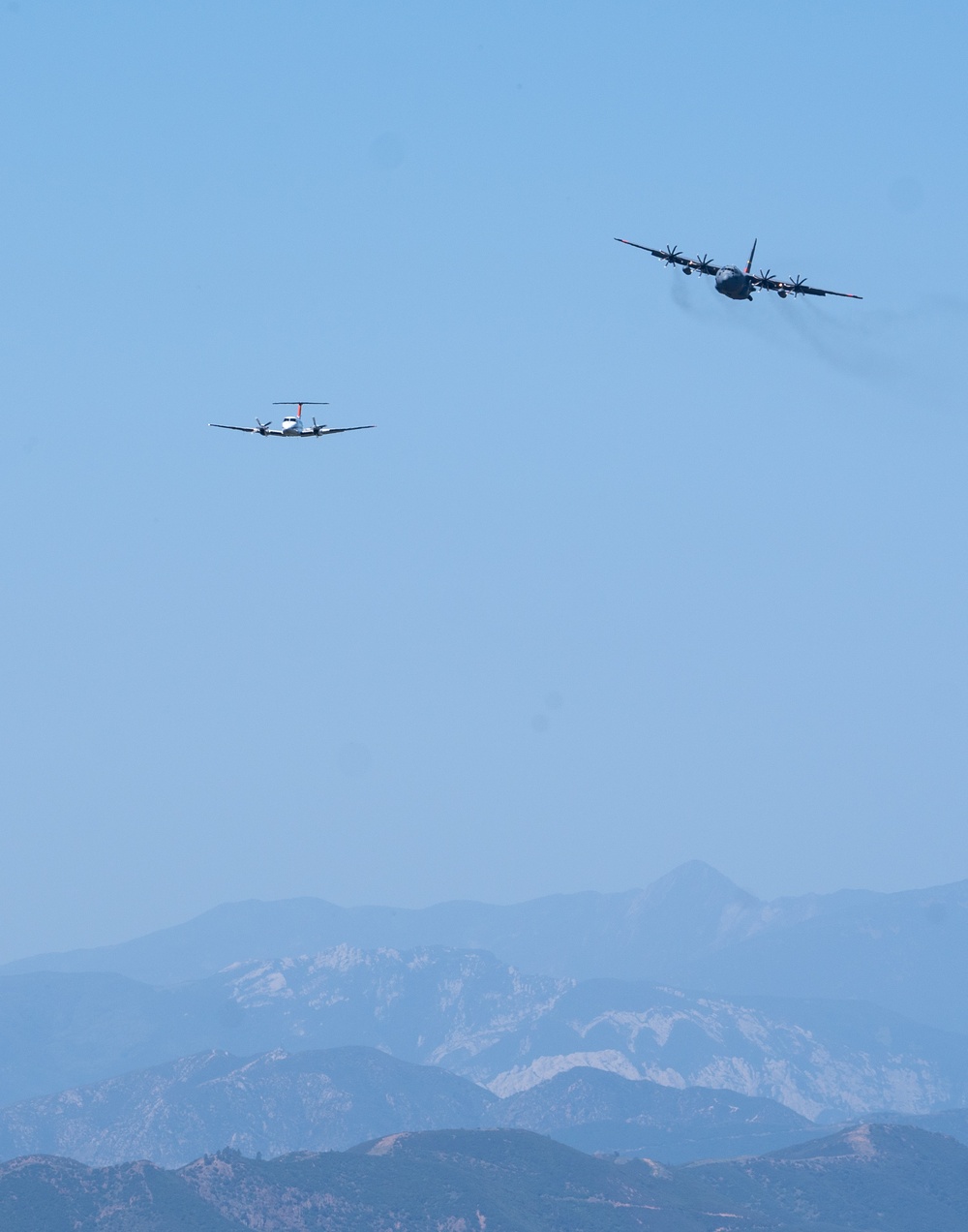 U.S. Forest Service Lead Plane leads a C-130 from Wyoming Air National Guard's 153rd Airlift Wing during Modular Airborne Fire Fighting System (MAFFS) Spring Training 2024