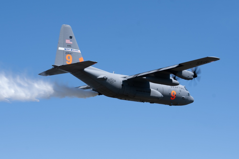 A C-130 (MAFFS 9) from Nevada Air National Guard's 152nd Airlift Wing performs a water drop May 8, 2024, during Modular Airborne Fire Fighting System (MAFFS) Spring Training 2024