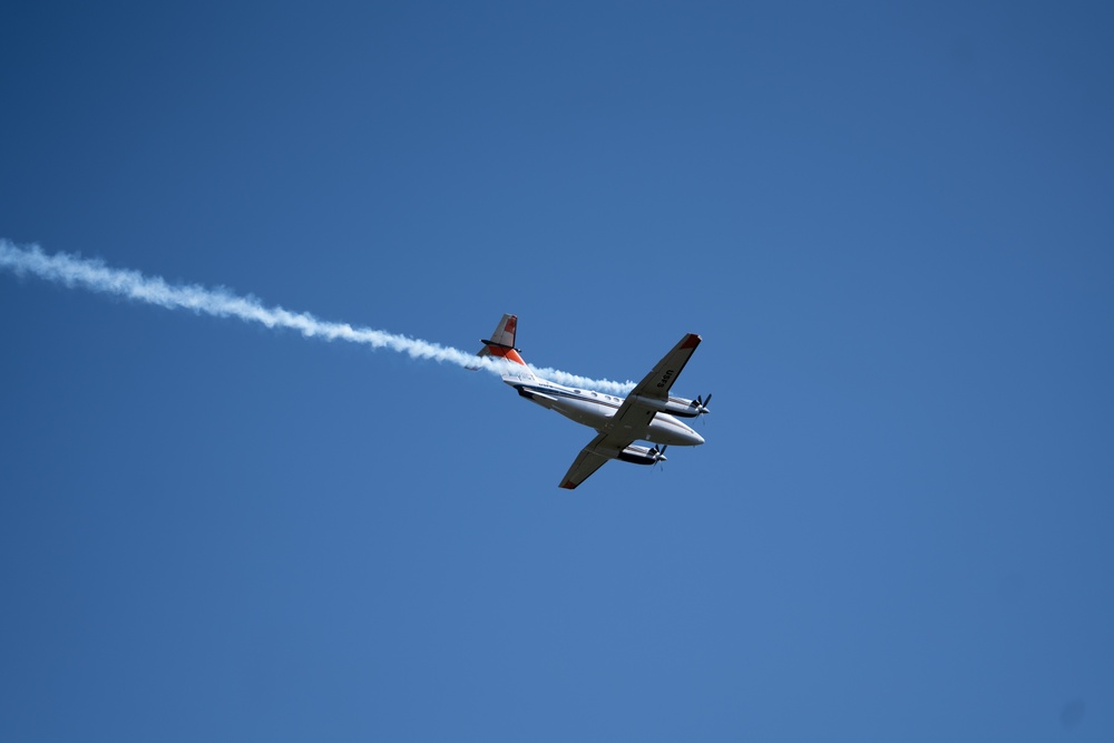 U.S. Forest Service Lead Aircraft dispenses a puff of smoke during Modular Airborne Fire Fighting System (MAFFS) Spring Training 2024