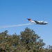 U.S. Forest Service Lead Aircraft dispenses a puff of smoke during Modular Airborne Fire Fighting System (MAFFS) Spring Training 2024