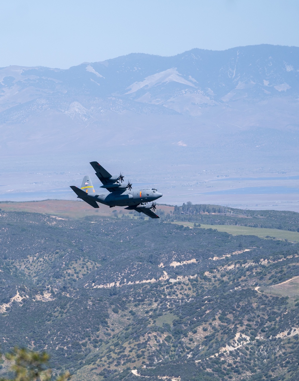 A C-130 (MAFFS 1) from Wyoming Air National Guard's 153rd Airlift Wing does a dry pass before performing a water drop May 8, 2024, during Modular Airborne Fire Fighting System (MAFFS) Spring Training 2024