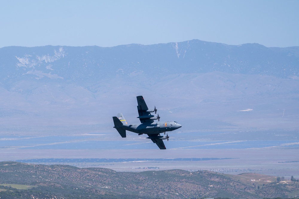 A C-130 from Wyoming Air National Guard's 153rd Airlift Wing does a dry pass prior to performing a water drop during Modular Airborne Fire Fighting System (MAFFS) Spring Training 2024