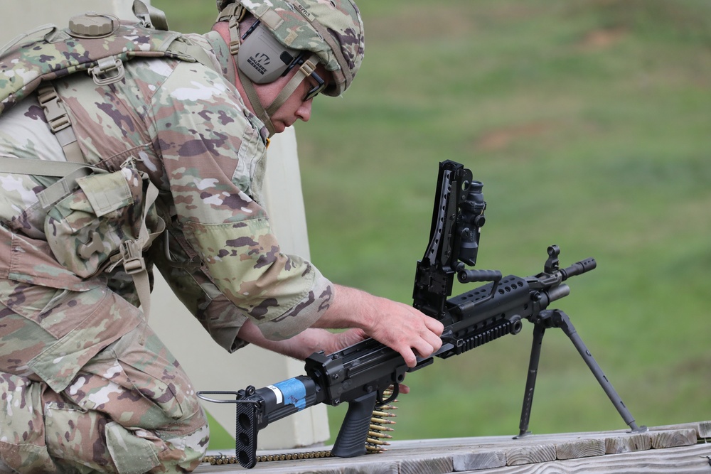 Virginia National Guard Soldier loads M249 SAW