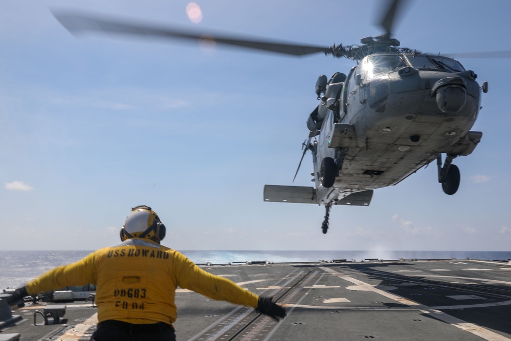 Rear Adm. Christopher Alexander, commander of Carrier Strike Group 9, visits the USS Howard in the South China Sea