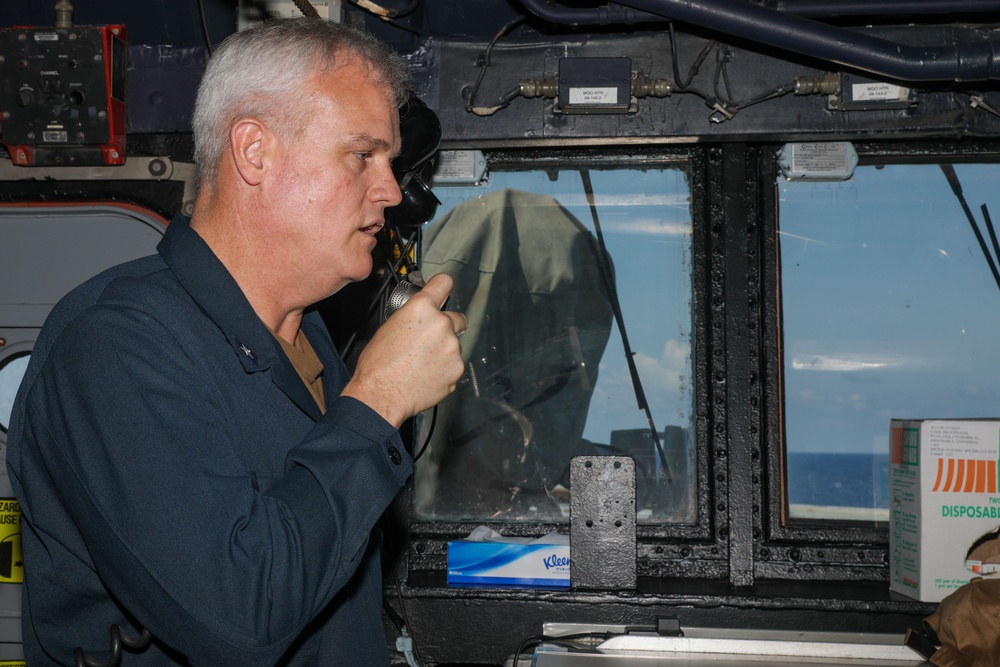 Rear Adm. Christopher Alexander, commander of Carrier Strike Group 9, visits the USS Howard in the South China Sea